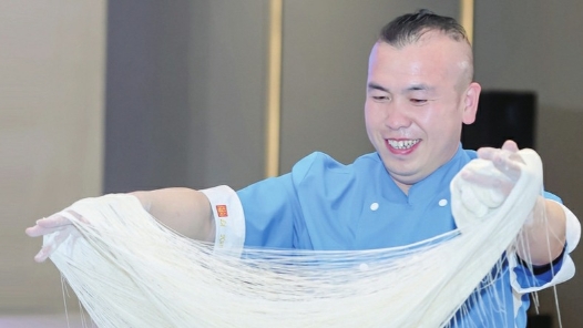 工匠汇�?022年三晋工匠｜王张龙：将山西面食“舞”向世界的宣传大�? title=