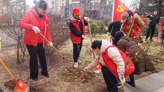 拉萨两级组织部门开展植树活? title=